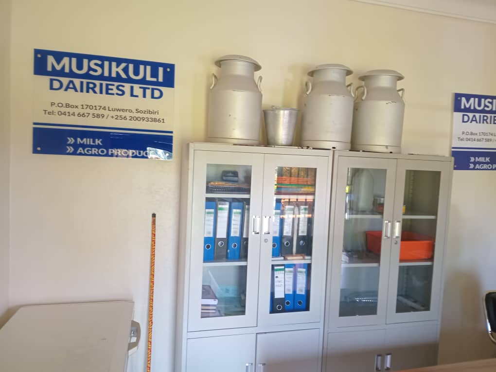 Office files and metal milk cans on cabinets